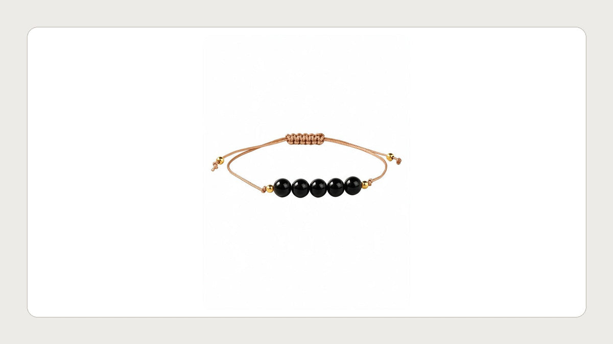 Black onyx and labradorite bracelet photographed on a white background