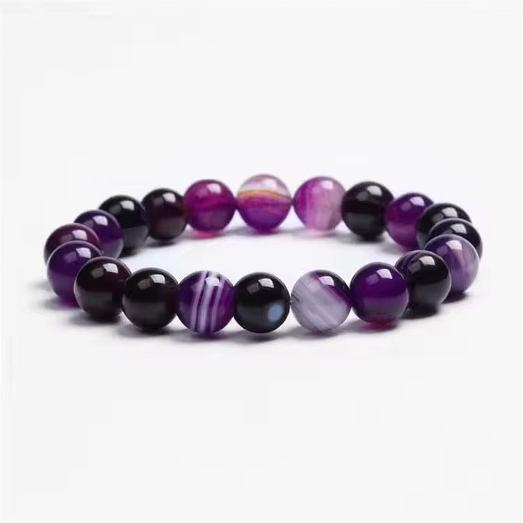 Violet agate bracelet with round purple beads and contrasting pale bands