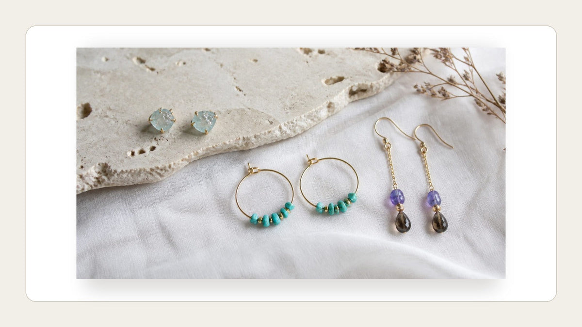 Natural stone earrings arranged with their posts and hooks visible